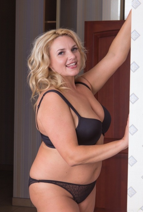 Overweight blonde housewife fingers her wet beaver after disrobing