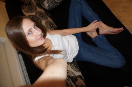 Beautiful amateur shows off her medium tits while taking sexy selfies